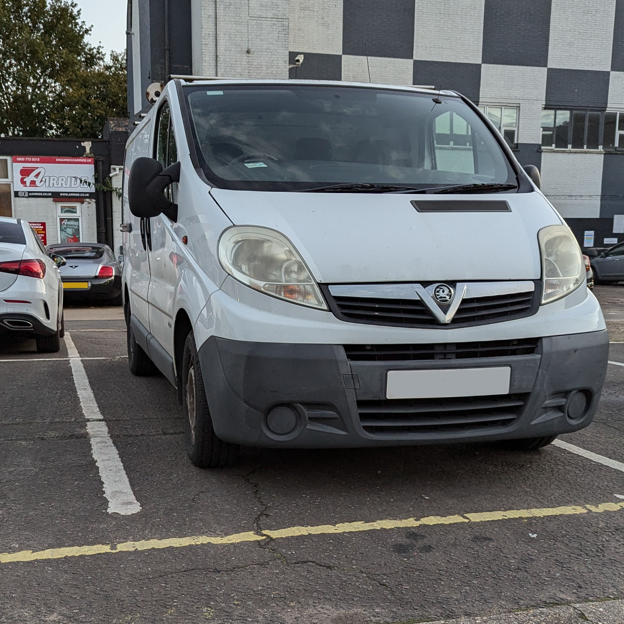 White X83 van in a car park