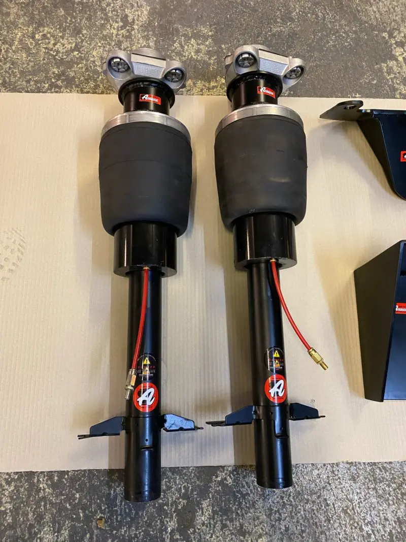 Pair of AirRide front suspension units - hose and valve not included.