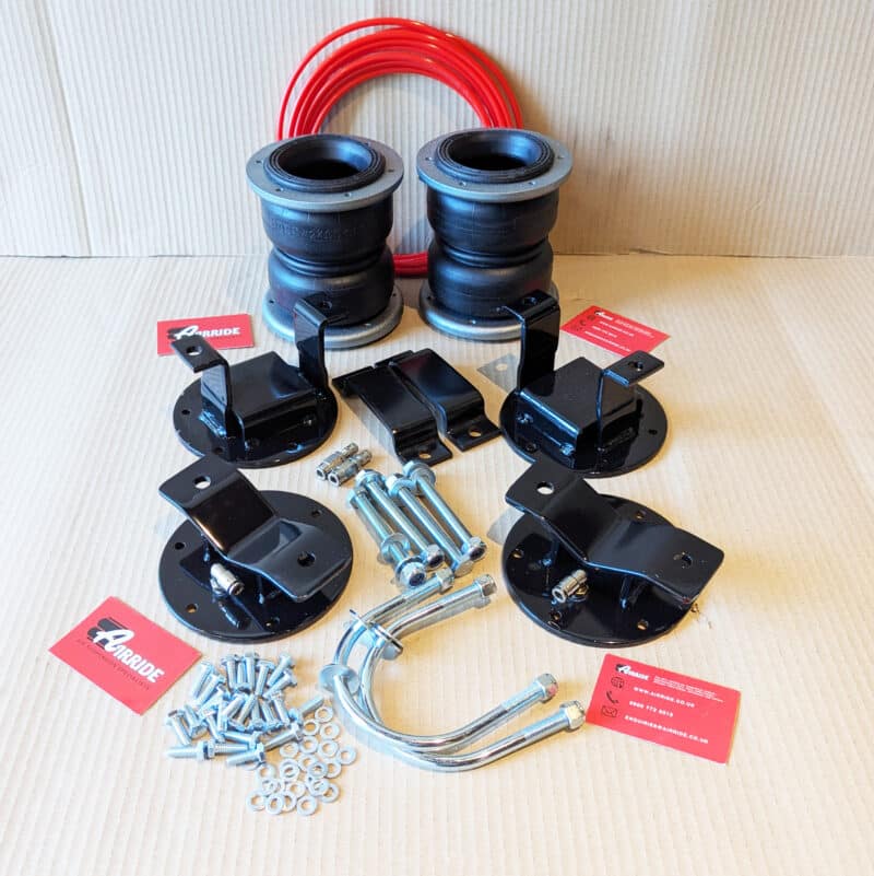 VW Amarok Gen 1 load support kit laid out on beige background