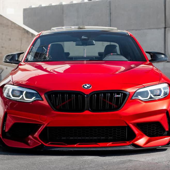 Red BMW 2 series F22 parked outside