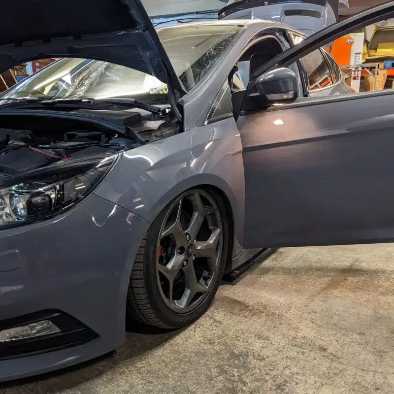 Lowered grey Ford Focus ST being worked on at AirRide workshop