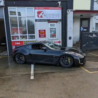 Nissan 370Z shown lowered outside AirRide