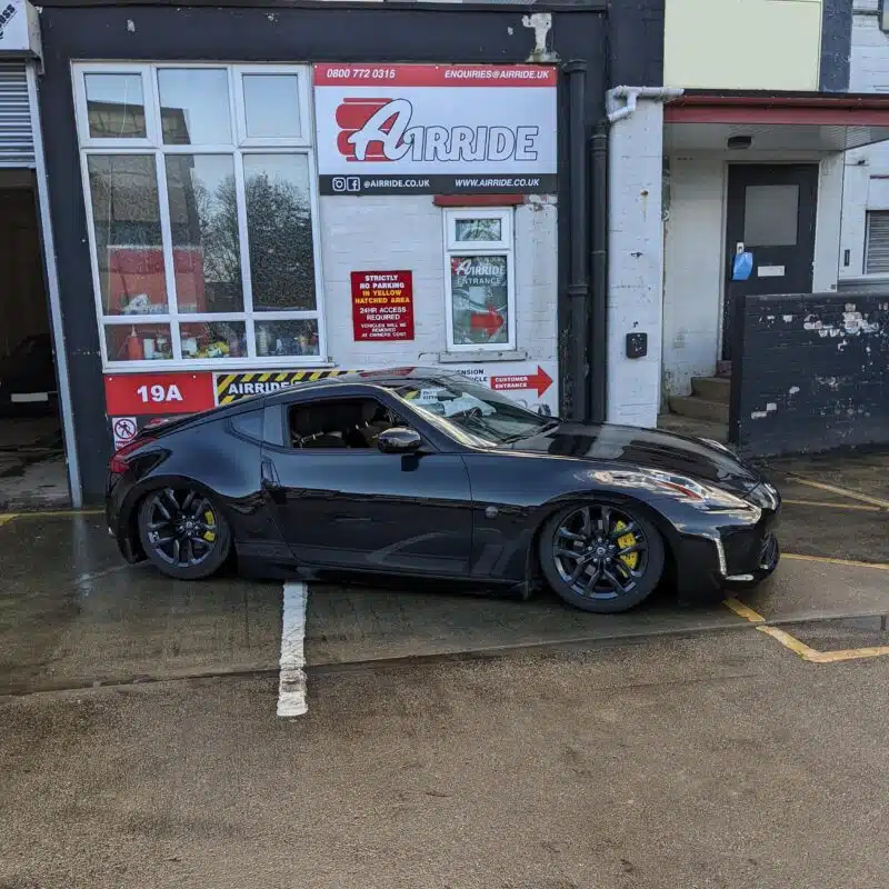 Nissan 370Z shown lowered outside AirRide