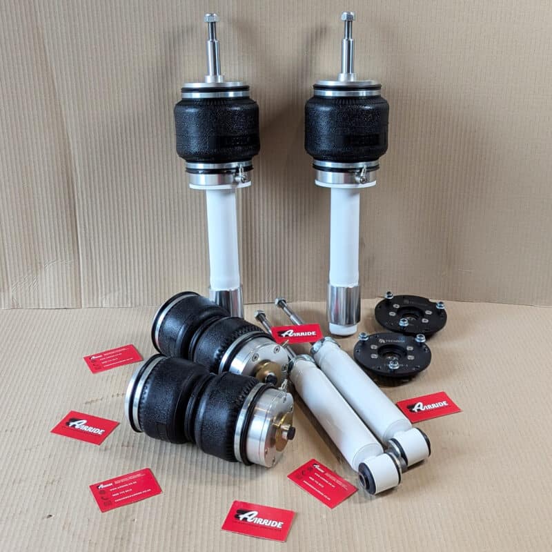 TA Technix BMW E61 front and rear kit on beige background
