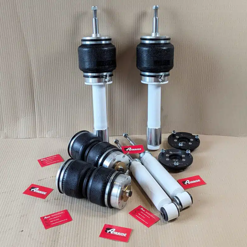 TA Technix BMW E61 front and rear kit on beige background