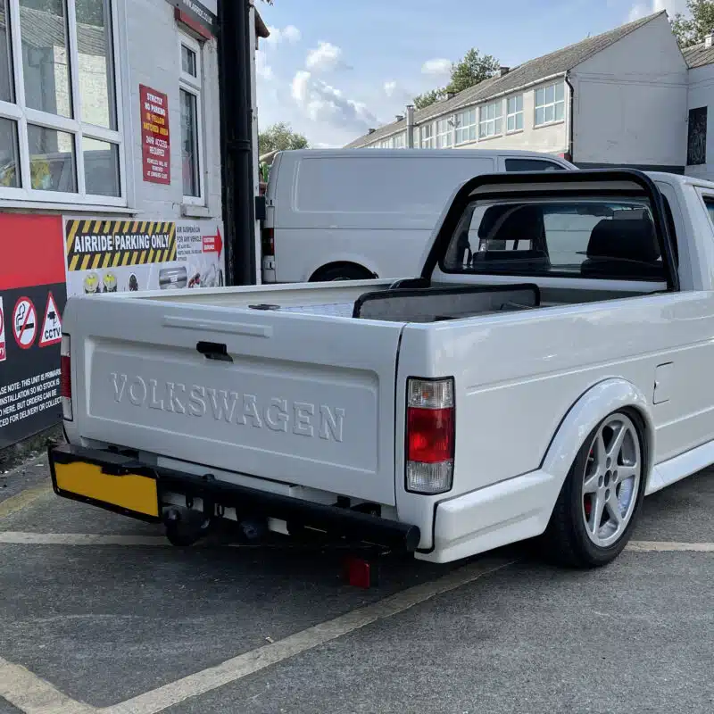 Rear view of a lowered Mk1 VW Caddy parked outside AirRide