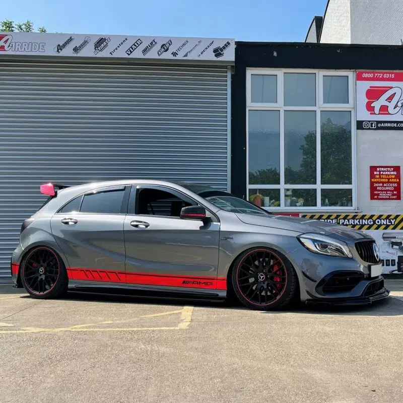 AMG45 with AirRide Custom kit parcked outside workshop
