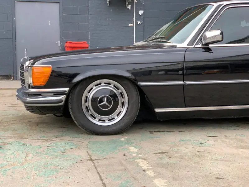Black S Class W116 mercedes front wheel and arch very low