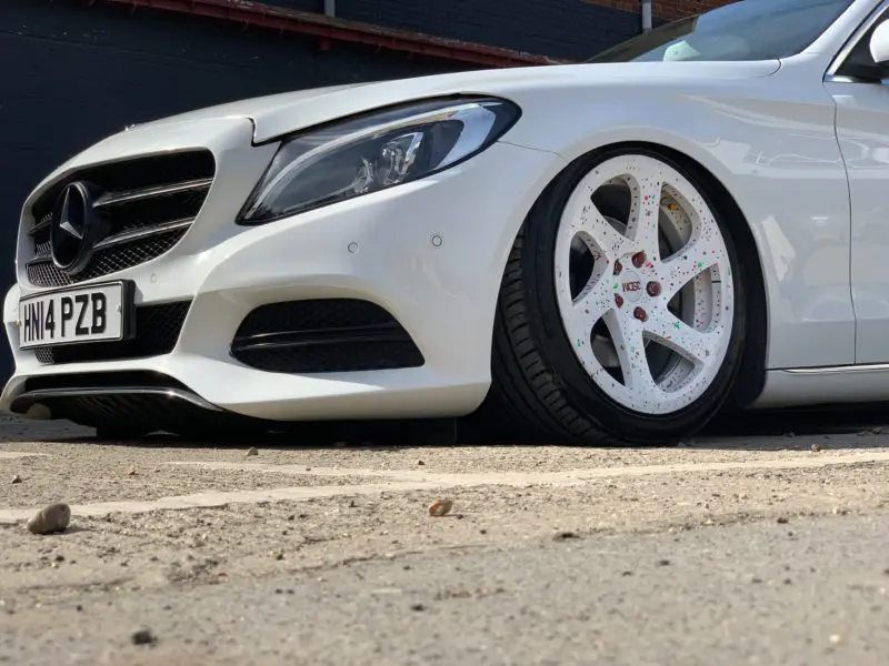 front wheel of very low mercedes in white