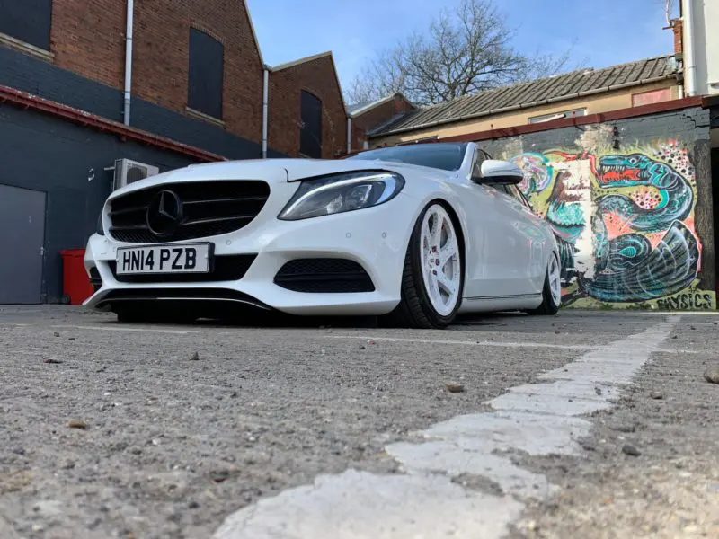 White Mercedes very low from the front