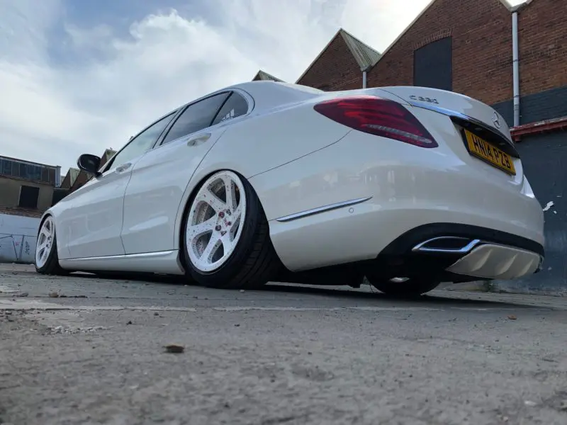 rear of low white mercedes