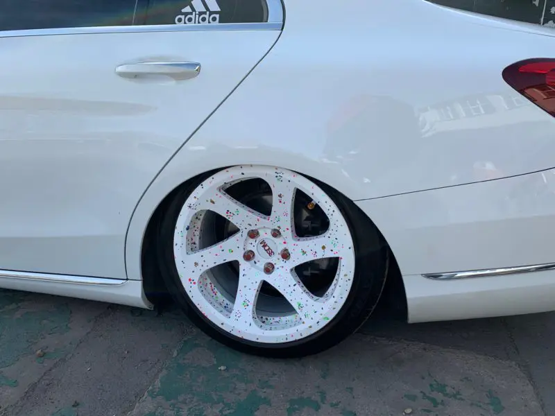 white mercedes rear wheel arch with wheel inside because its so low
