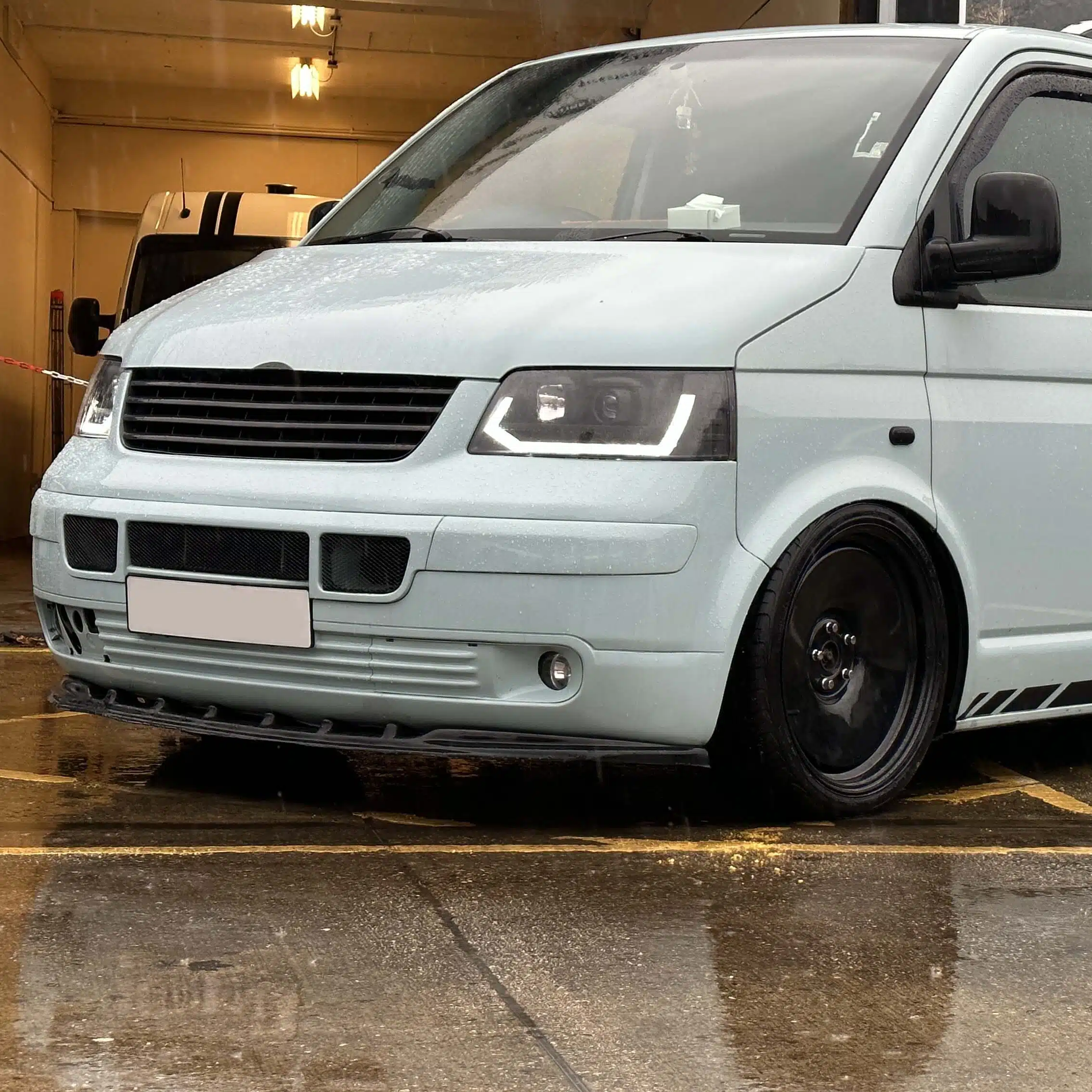 Lowered light blue VW Transporter T5 outside AirRide