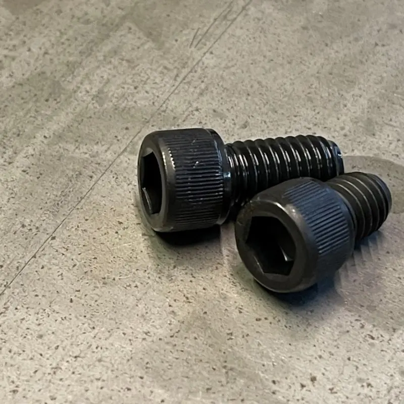 Two bolts in black next to each other