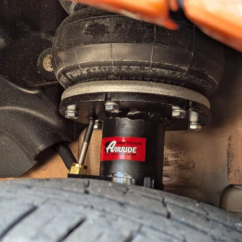 Close up of a Ford van strut installed on a vehicle