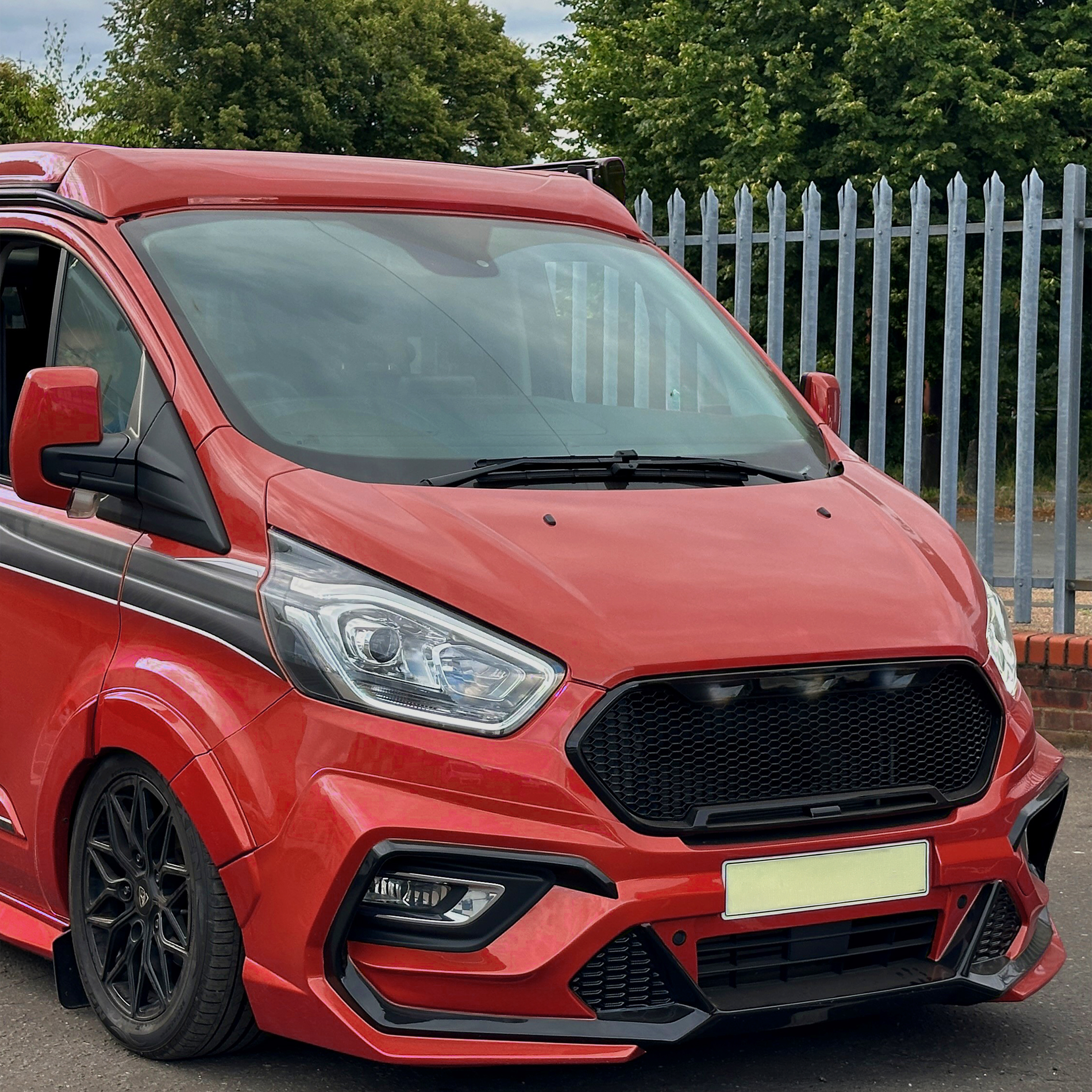 Close up of front of Ford Transit Custom Modified van which is very low