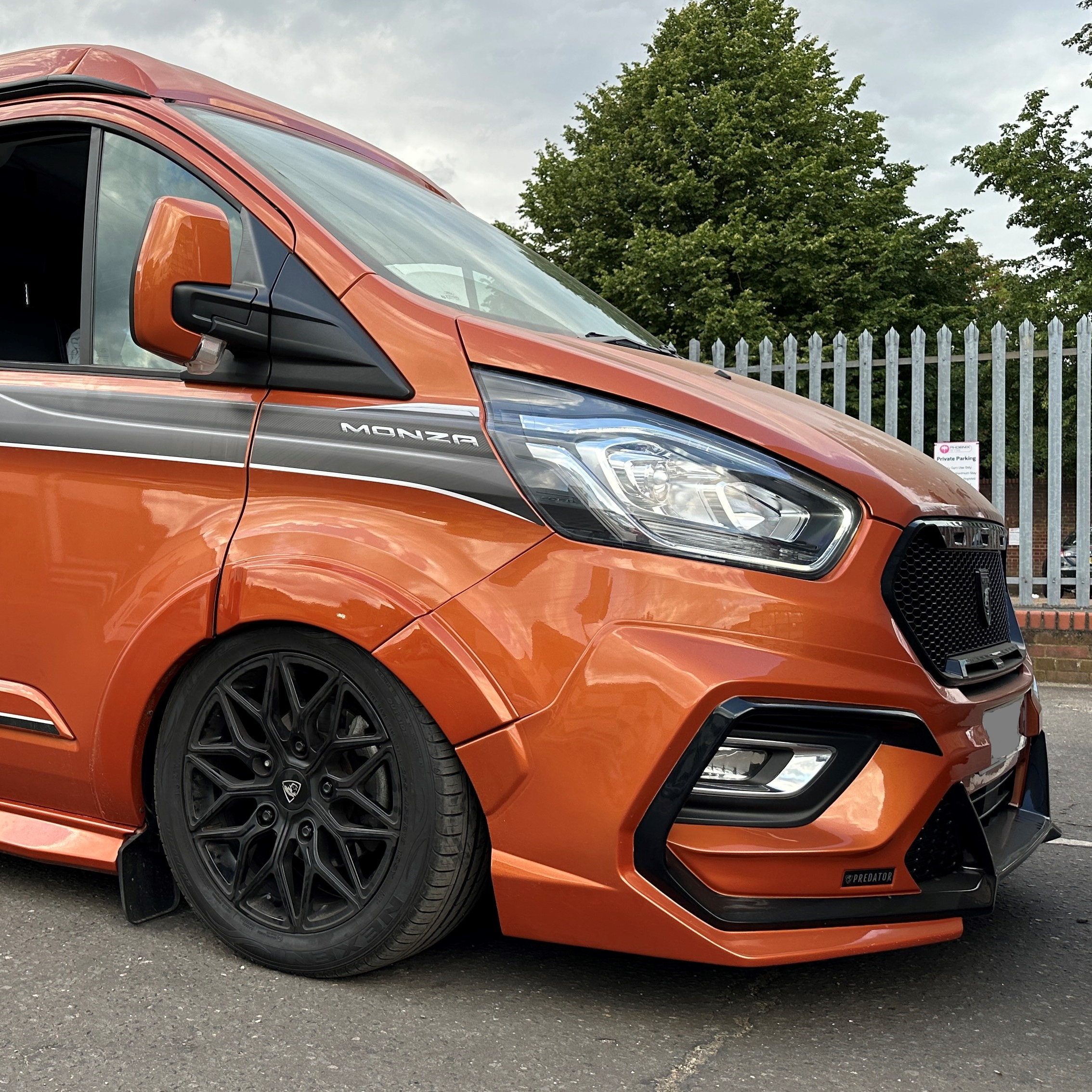 Lowered orange Swift Monza campervan