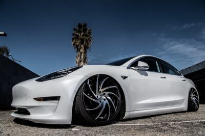 White Tesla Model 3 lowered on airide suspension