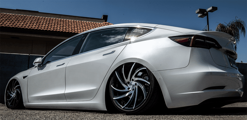 rear end of bagged tesla model 3 lowered on air