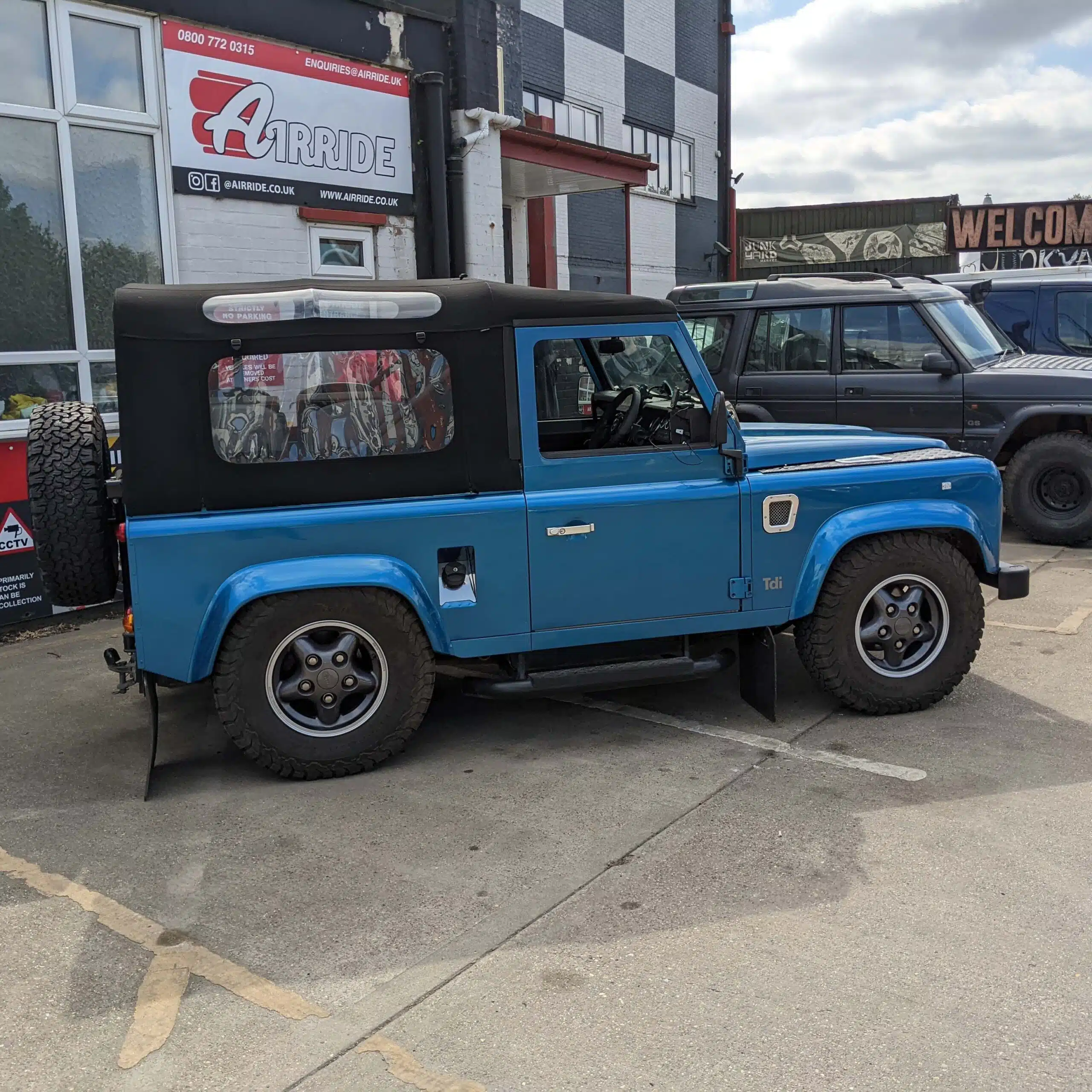 Lowered 1997 Defender shown parked outside AirRide