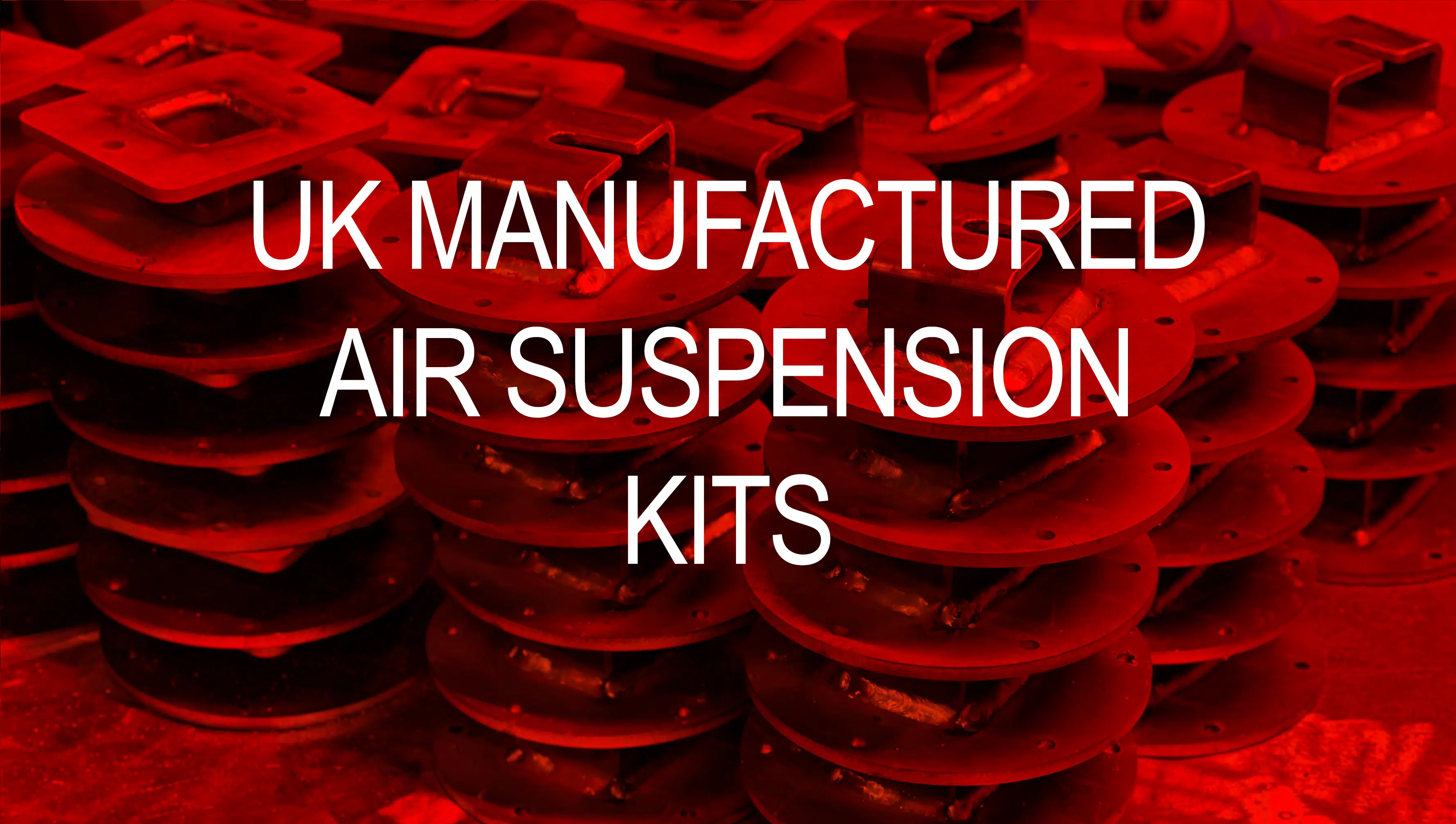 Red Image showing air suspension brackets in a neat pile being manufactured