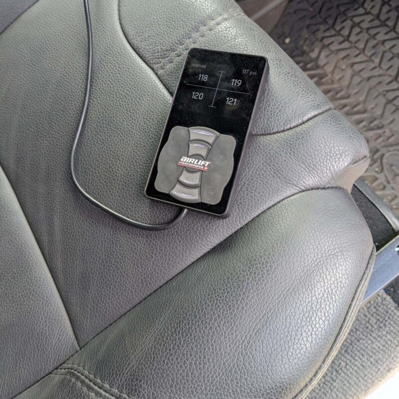 3P wired controller shown on a grey Defender seat