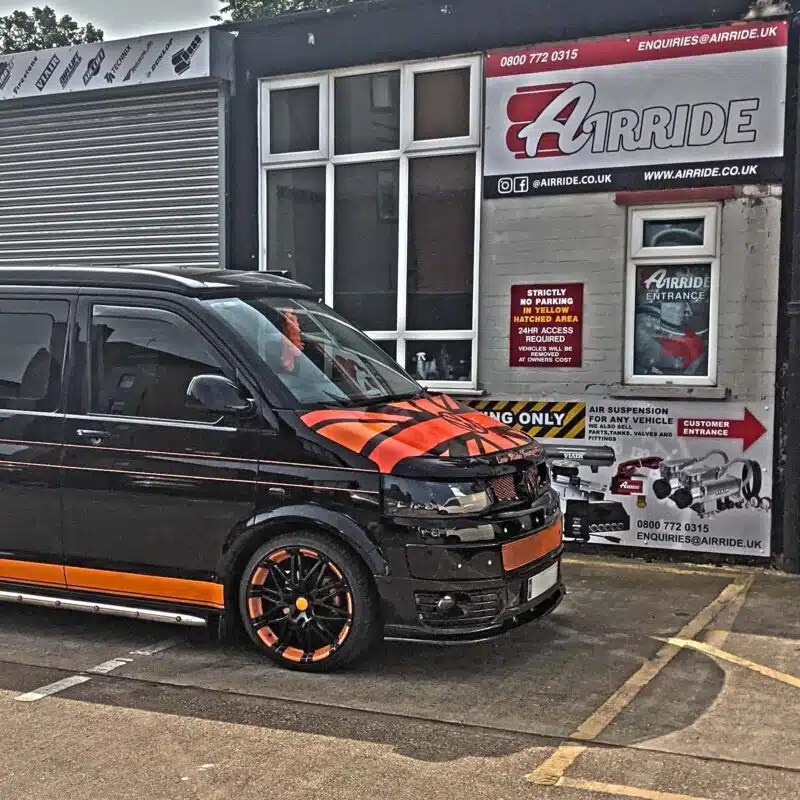 Black and orange T5 on air suspension shown parked outside AirRide
