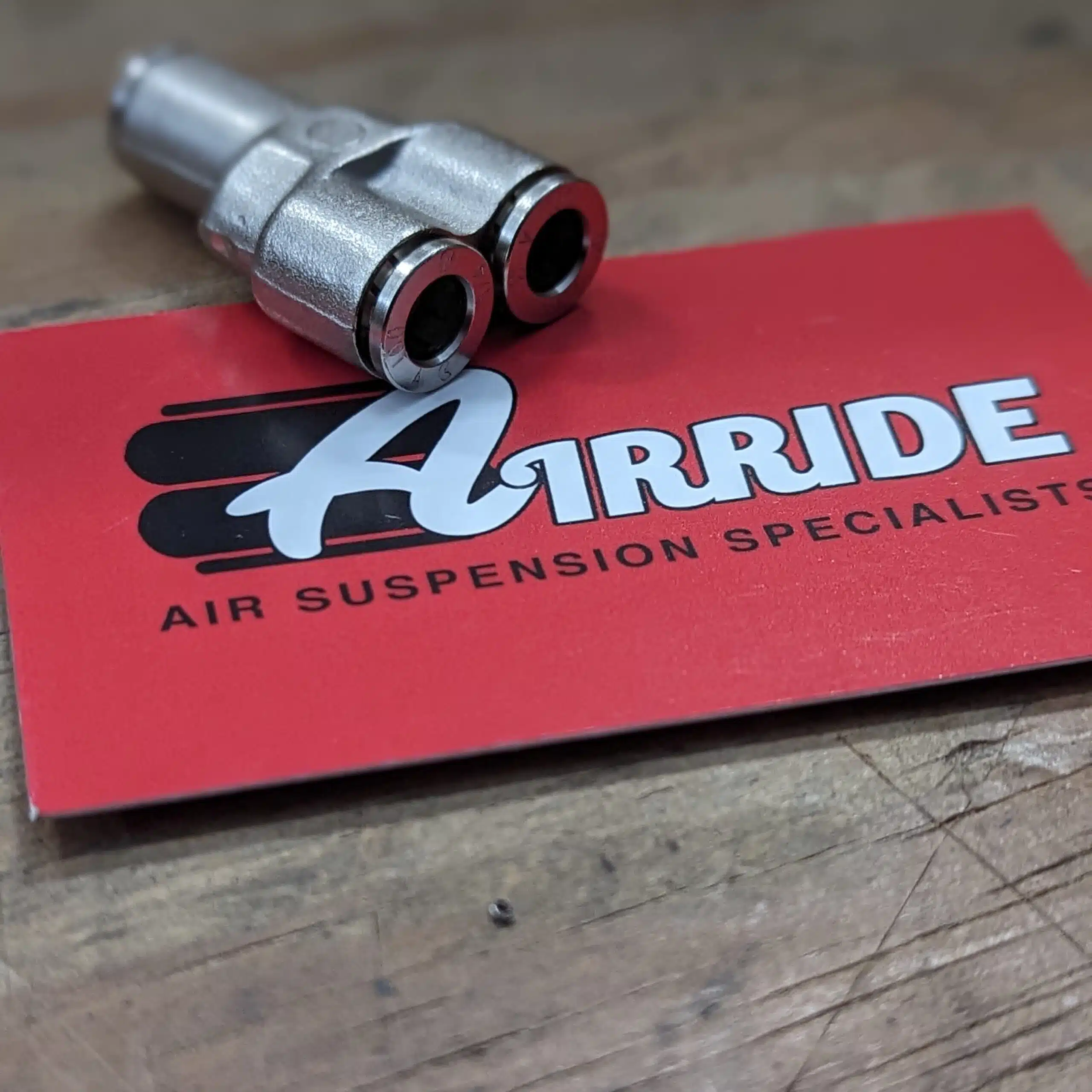 1/4 inch brass push to connect Y fitting with Airride business card