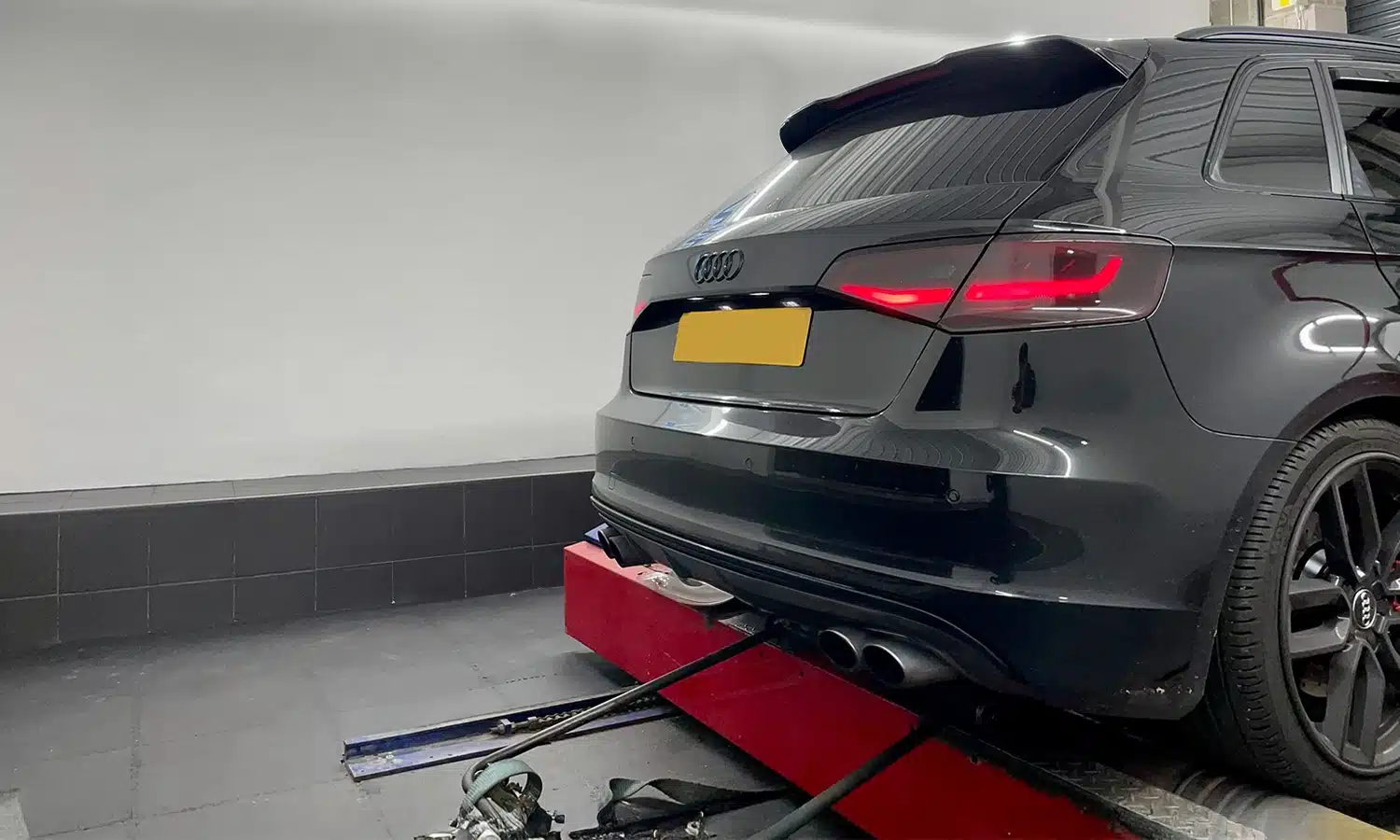 Modified Audi with air suspension on a dyno being power tested