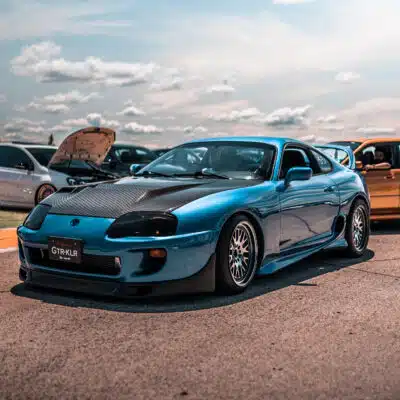 Toyota Supra Mk4 in a sunny parking lot