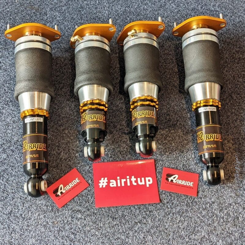 AirRide Gold Mazda MX-5 kit laid out on blue background