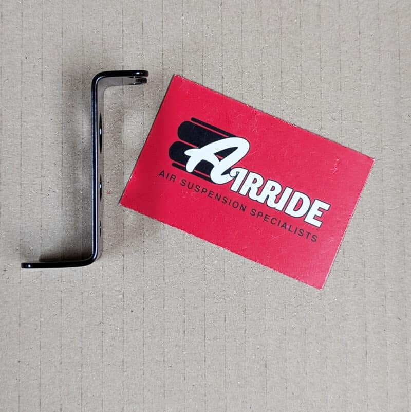 Side view of water trap bracket on beige background